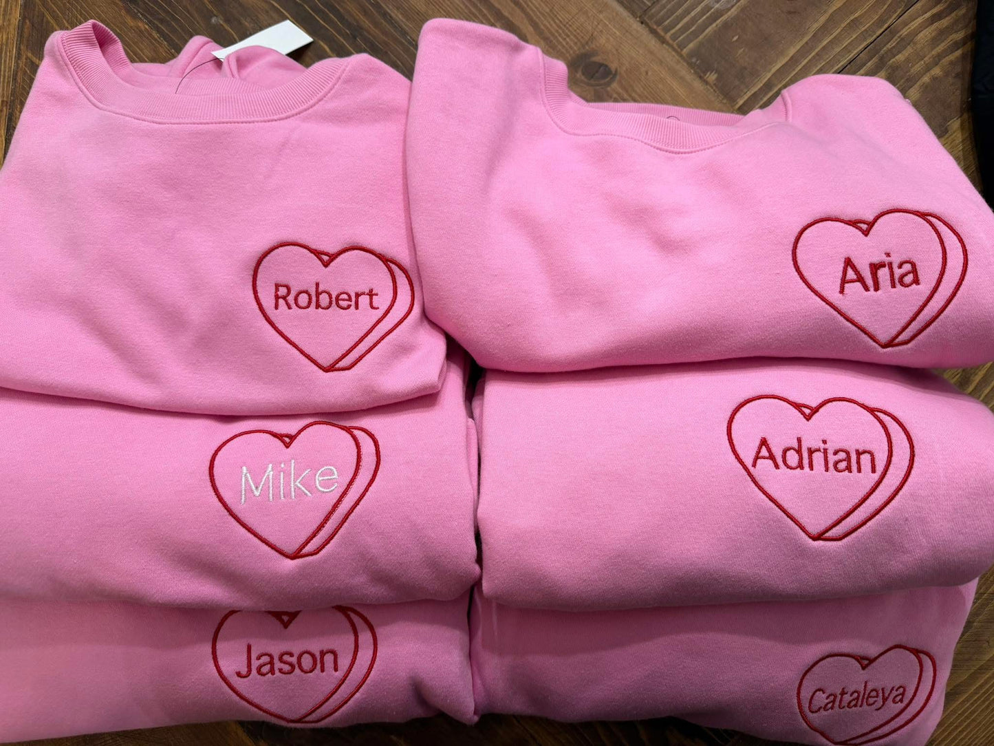 Custom embroidered Valentine's Day crewneck sweatshirt with personalized name in red heart design
